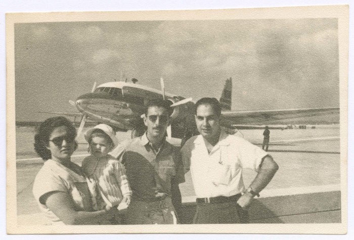 A Woman, a Baby and Two Men at an Airport