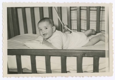 A Photograph of a Child in His Crib