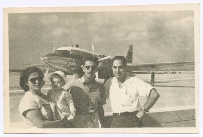 A Woman, a Baby and Two Men at an Airport