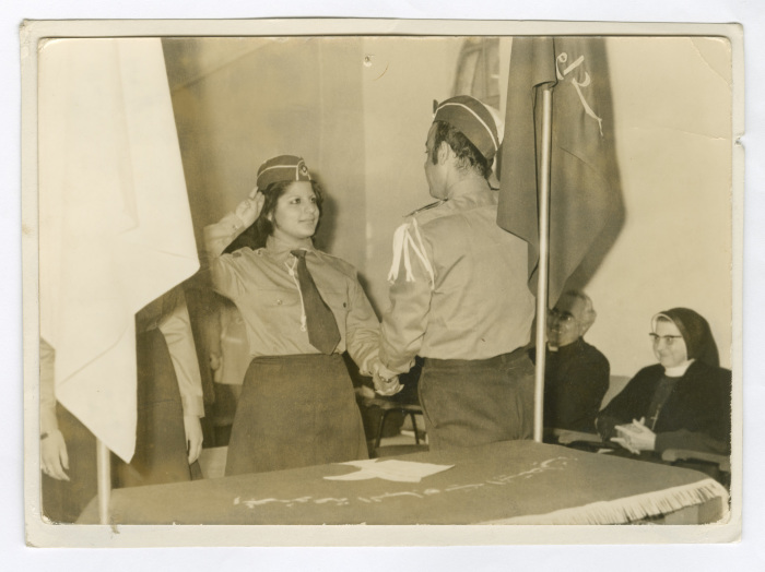 A Photograph of a Female Scout Doing the Scout Salute