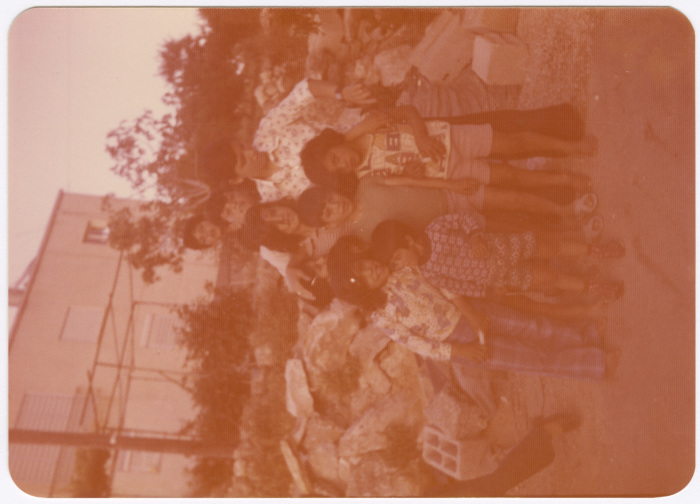 A Group Photograph of Men and Children 