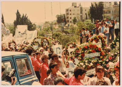 Masses Carrying Wreaths during Shaheed Omar al-Qasim
