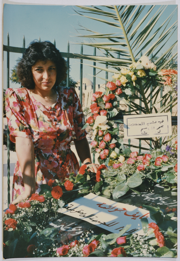 Amal al-Qasim Standing Next to Her Shaheed Brother's Grave, Jerusalem, 1989