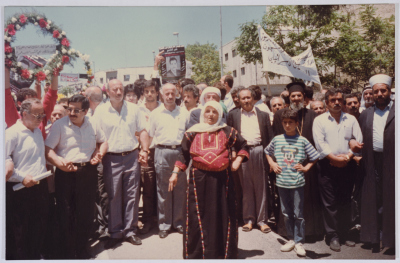 An Elderly Palestinian Woman at the Front of Shaheed Omar al-Qasim