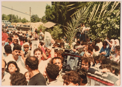 Mourners Lifting a Poster of Shaheed Omar al-Qasim during His Funeral, Jerusalem, 6 June 1989