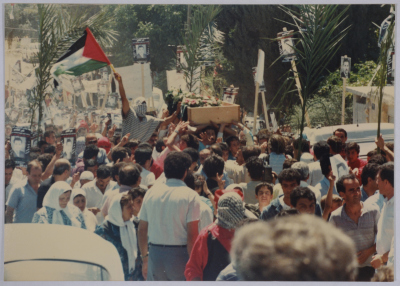 Palestinian Youth Lifting the Body of Shaheed Omar al-Qasim