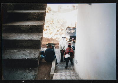 A Photograph of People Handing Out Sweets to Celebrate the Arrival of Ramadan, 2004