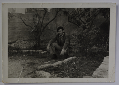 Portrait of a guy sitting between the trees in Beit Safafa, Jerusalem