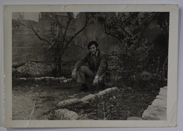 Portrait of a guy sitting between the trees in Beit Safafa, Jerusalem