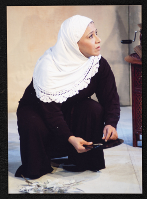 A Photograph of Sanaʾ Salhab During the Theatrical Performance of "Ghuyum Fi Rihla Jabaleya", al-Midan Theatre 
