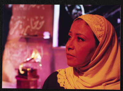 A Photograph of Sanaʾ Salhab During the Theatrical Performance of "Ghuyum Fi Rihla Jabaleya", al-Midan Theatre 
