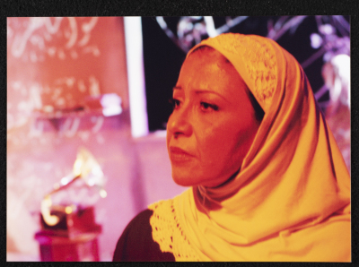 A Photograph of Sanaʾ Salhab During the Theatrical Performance of "Ghuyum Fi Rihla Jabaleya", al-Midan Theatre 
