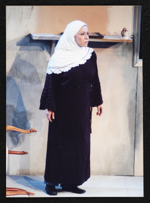 A Photograph of Sanaʾ Salhab During the Theatrical Performance of "Ghuyum Fi Rihla Jabaleya", al-Midan Theatre 
