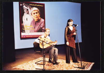 A Photograph of ʾAmal Murkus and Saʿid Murad Singing at the Memorial Service Held in Honour of Actress Bushra Qaraman
