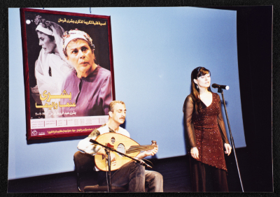 A Photograph of ʾAmal Murkus and Saʿid Murad Singing at the Memorial Service Held in Honour of Actress Bushra Qaraman