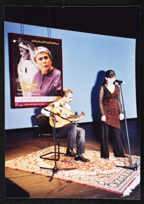 A Photograph of ʾAmal Murkus and Saʿid Murad Singing at the Memorial Service Held in Honour of Actress Bushra Qaraman