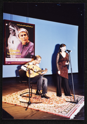 A Photograph of ʾAmal Murkus and Saʿid Murad Singing at the Memorial Service Held in Honour of Actress Bushra Qaraman