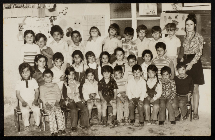 A Photograph of Sur Baher Students with Their Teacher Nuha Yaʿish 