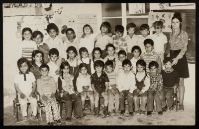 A Photograph of Sur Baher Students with Their Teacher Nuha Yaʿish 