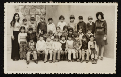A Photograph of Sur Baher Students with Their Teacher Nuha Yaʿish 