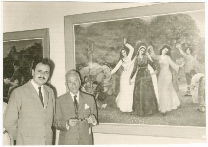 Two men at an art exhibition