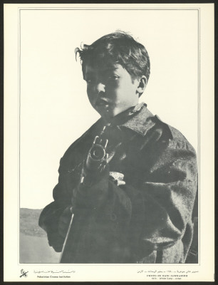 "A Palestinian Child Holding a Gun at Wihdat Camp by Hany Jawhariyye", A Photograph from Palestinian Images Magazine, 1970