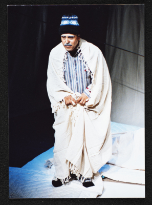 A Photograph of Muhammad ʿudetallah During the Theatrical Performance "Ahlam Shaqeyyeh", al-Midan Theatre, 2001