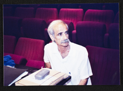 A Photograph of a Theatre Staff Member at the "Buʾs Wa Ruʿb Reich ath-Thaleth" Rehearsals, al-Midan Theatre, 2002