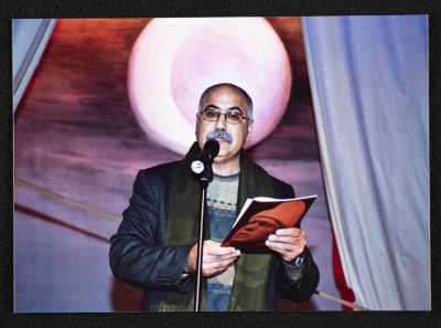 A Photograph of the Toastmaster of the Honorary Ceremony Held for the "Ahlam Shaqeyyeh" Theatre Staff, al-Midan Theatre, 2001