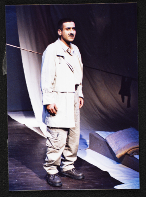 A Photograph of Mahmud Qadah During the Theatrical Performance "Ahlam Shaqeyyeh", al-Midan Theatre, 2001	