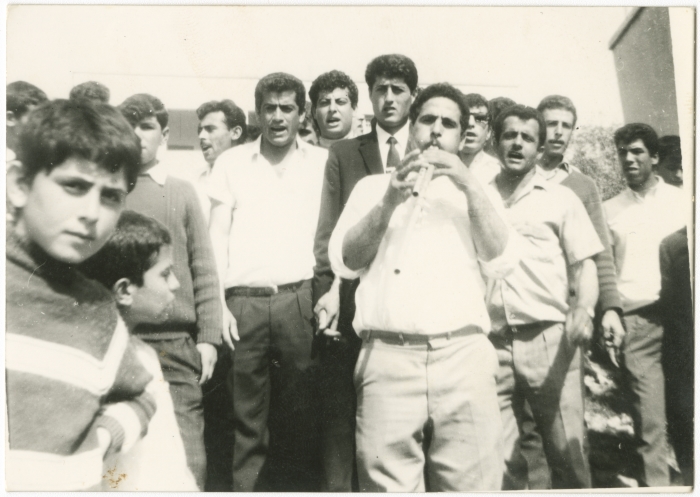 A group of men during a groom's zaffa in the village of Araba