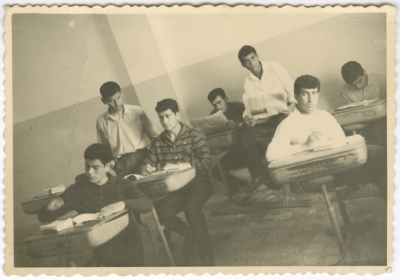 A group of Nazareth secondary school students in the classroom read the newspapers