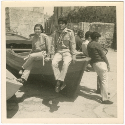 A girl from the Naamna family with Scouts coach Noman Shehadeh in a training course