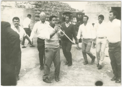 A group of men dancing the Palestinian Dabkeh