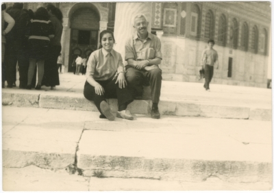A girl from the Naamneh family and a teacher from the family of Araf are sitting in the courtyard of the Al-Aqsa Mosque