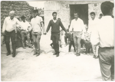 A group of men dancing the Palestinian Dabkeh