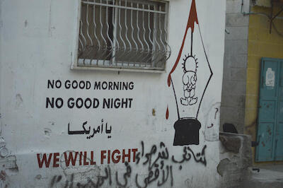 A Patriotic and Resisting Slogan, and Handala Model on a Wall in Dheisheh Camp, 2015