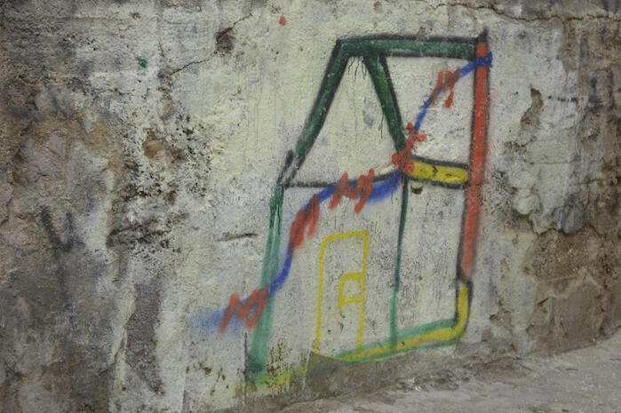 A Photograph of Different Drawings on a wall in ad-Dheisheh Camp, Bethlehem, 2015