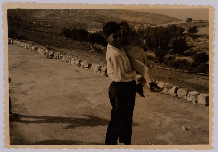 A Photograph of Saadeah Bsoul Holding a Child, Reineh, 1966