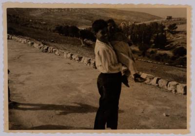 A Photograph of Saadeah Bsoul Holding a Child, Reineh, 1966