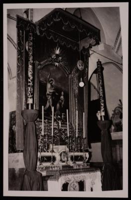 A Photograph of Some Candlesticks in front of Christ