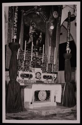 A Photograph of Some Candlesticks in front of Christ