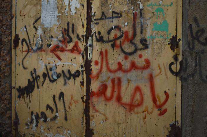 A Photograph of Patriotic Slogans on an Old House Door in ad-Dheisheh Camp, 2015