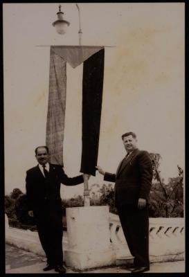 Saadeh al-Jalad Grabbing the Palestinian Flag with Another Man
