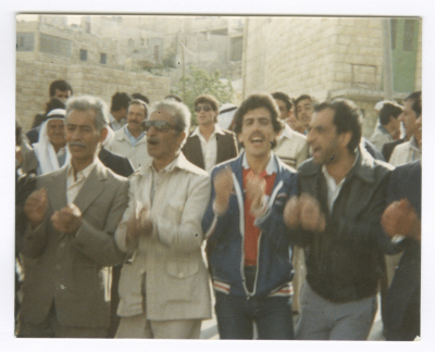 Men Clapping at a Wedding