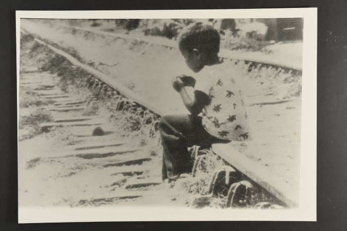 A Child Sitting on a Railway, 1980- 1989