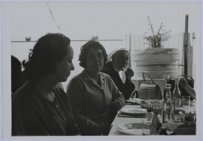 A Photograph of Two Girls and a Man