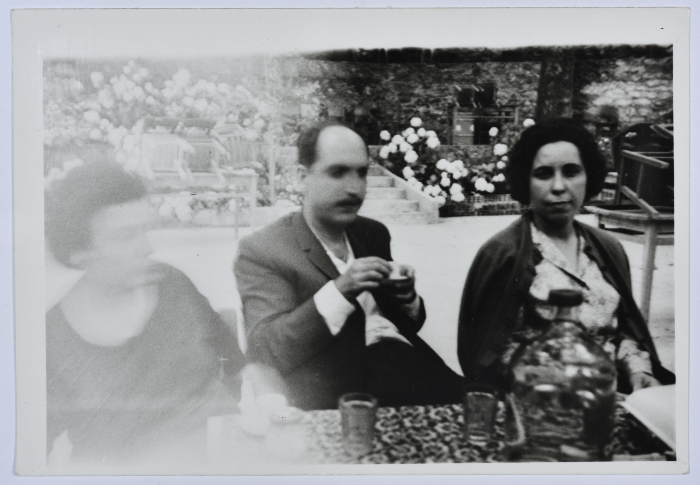 A Photograph of Two Girls and a Man