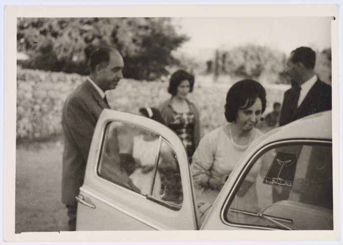 A Photograph of Two Girls and Two Men