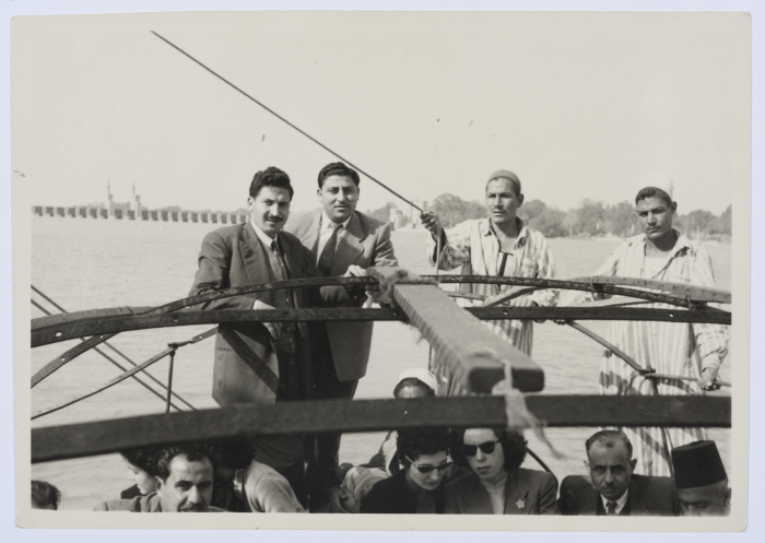 A Photograph of Two Girls and Several Men